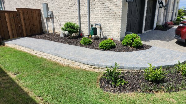 Paver Walkway and Retaining Wall Installation in Celina, TX - Property Repair Doctors completed this exterior improvement project in Celina, TX by converting a sloped grass area into a clean, functional paver walkway with a short retaining wall.
The original side yard had a downslope that was difficult to use and did not provide a finished transition between the driveway, side yard, and backyard gate area. Our team installed a compact retaining wall to help manage the grade change and added a paver walkway that improved access, curb appeal, and overall usability of the space.
This project gave the homeowner a cleaner entry path, better flow around the property, and a more polished exterior appearance that matched the style of the home. Paver Walkway and Retaining Wall Installation in Celina, TX - Property Repair Doctors completed this exterior improvement project in Celina, TX by converting a sloped grass area into a clean, functional paver walkway with a short retaining wall.
The original side yard had a downslope that was difficult to use and did not provide a finished transition between the driveway, side yard, and backyard gate area. Our team installed a compact retaining wall to help manage the grade change and added a paver walkway that improved access, curb appeal, and overall usability of the space.
This project gave the homeowner a cleaner entry path, better flow around the property, and a more polished exterior appearance that matched the style of the home.