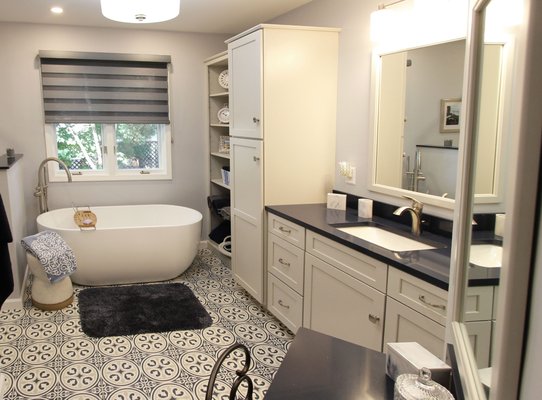 Gray, Blue and White Bathroom with Soaker Tub, Makeup Vanity and Tiled Shower - In this master bathroom renovation, a large built-in jetted tub was removed and replaced with a freestanding soaker tub creating a beautiful spa-like environment. Art Deco style tile was used on the floor and as a shower accent to add character that make a chic statement. Gray, Blue and White Bathroom with Soaker Tub, Makeup Vanity and Tiled Shower - In this master bathroom renovation, a large built-in jetted tub was removed and replaced with a freestanding soaker tub creating a beautiful spa-like environment. Art Deco style tile was used on the floor and as a shower accent to add character that make a chic statement.