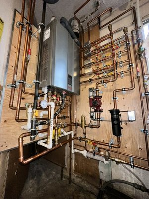COMBI Boiler install - Used to be a large hot water tank and a blue box boiler. we removed them and installed a combi boiler which heats your domestic drinking water and hydronic heating water. COMBI Boiler install - Used to be a large hot water tank and a blue box boiler. we removed them and installed a combi boiler which heats your domestic drinking water and hydronic heating water.