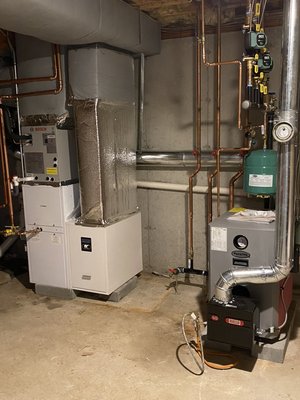Oil Boiler with Heatpump - Oil Boiler Replacement & Bosch Heat Pump with Hydro Air Handler Installation
At Fix It With Fagundes, we removed an old oil boiler and an outdated AC-only air handler system. We upgraded the home’s comfort with a new Trio 87% efficient oil boiler paired with a Bosch heat pump and hydro air handler. This modern combination provides the homeowner with year-round efficiency — using the Bosch heat pump for cooling and supplemental heating, while the Trio oil boiler delivers reliable backup heat on the coldest winter days.

This system gives the homeowner:

A high-performance Trio 87% efficient oil boiler for dependable heating

Energy savings and comfort from a Bosch heat pump system

A versatile hydro air handler that integrates heating and cooling in one system

Long-term reliability with professional installation

If you’re searching for oil boiler replacement, Bosch heat pump installers, or hydro air handler systems in Massachusetts or Southern New Hampshire, Fix It With Fagundes is the trusted local expert for efficient heating and cooling solutions.