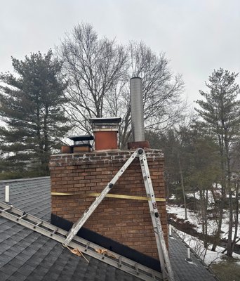 Basement Fireplace Restoration in Upper Saddle River - Removed the existing flue tiles. Relined the fireplace flue, from the top of the smoke chamber to the top of the chimney, with a new, lifetime warranty, stainless steel chimney liner. Restored all four walls of the smoke chamber using Chamber Tech 2000 refractory cement. Poured Chim-Mix insulation around the entire chimney liner, from top to bottom. Installed a new, top mount, cable driven, damper-cap combo. Basement Fireplace Restoration in Upper Saddle River - Removed the existing flue tiles. Relined the fireplace flue, from the top of the smoke chamber to the top of the chimney, with a new, lifetime warranty, stainless steel chimney liner. Restored all four walls of the smoke chamber using Chamber Tech 2000 refractory cement. Poured Chim-Mix insulation around the entire chimney liner, from top to bottom. Installed a new, top mount, cable driven, damper-cap combo.