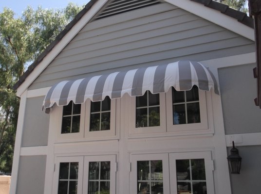 Long Dome Stationary Awning - Before & After - The Long Dome is a variation of our standard Dome awning. It is ideal for those who wish to maintain the pleasing visual appeal of the Dome style but have wider applications and limited overhead clearance. Long Dome Stationary Awning - Before & After - The Long Dome is a variation of our standard Dome awning. It is ideal for those who wish to maintain the pleasing visual appeal of the Dome style but have wider applications and limited overhead clearance.