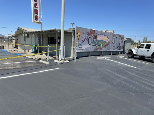 Cheers motorcycle bar and restaurant parking lot - This project was at Cheers restaurant and motorcycle bar in Ramona. As you can see with the before photo this parking lot was in need of seal coat, crack fill, and handicap parking lot stalls. We successfully gave them an amazing job that gives them the curb appeal they deserve being right on the highway. Cheers motorcycle bar and restaurant parking lot - This project was at Cheers restaurant and motorcycle bar in Ramona. As you can see with the before photo this parking lot was in need of seal coat, crack fill, and handicap parking lot stalls. We successfully gave them an amazing job that gives them the curb appeal they deserve being right on the highway.