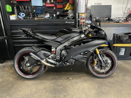 06 Yamaha R6 Crash Job. - This 2006 Yamaha R6 came to us in rough shape after a major crash — damaged swingarm, bent bars, destroyed fairings, and electrical issues throughout. Our team performed a full teardown and methodical restoration using OEM components and professional repair techniques. With the structural integrity fully restored and aesthetics brought back to factory-clean condition, this R6 is now road-ready and better than ever.
Built with precision. Restored with pride. RevXotic Motorsports. 06 Yamaha R6 Crash Job. - This 2006 Yamaha R6 came to us in rough shape after a major crash — damaged swingarm, bent bars, destroyed fairings, and electrical issues throughout. Our team performed a full teardown and methodical restoration using OEM components and professional repair techniques. With the structural integrity fully restored and aesthetics brought back to factory-clean condition, this R6 is now road-ready and better than ever.
Built with precision. Restored with pride. RevXotic Motorsports.