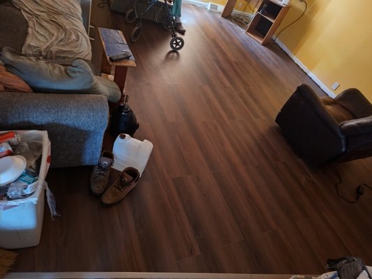 Floor Repair in Greensburg Indiana - House in Greensburg with a crumbling, water-damaged subfloor and carpet that was tripping people, including a customer who was mobility-impaired. We installed new subfloor and a luxury vinyl plank flooring that is walker-friendly, along with low-profile transitions to the bedrooms, bathroom, and kitchen. Should help keep everyone safe and healthy! Floor Repair in Greensburg Indiana - House in Greensburg with a crumbling, water-damaged subfloor and carpet that was tripping people, including a customer who was mobility-impaired. We installed new subfloor and a luxury vinyl plank flooring that is walker-friendly, along with low-profile transitions to the bedrooms, bathroom, and kitchen. Should help keep everyone safe and healthy!