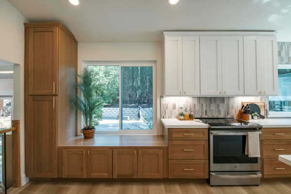 Kitchen Remodel - The completed kitchen is a stunning example of modern elegance and functionality. The combination of warm wood tones, crisp white, and ample lighting created a spacious, inviting, and highly efficient cooking and gathering area, perfectly blending contemporary style with natural warmth. Kitchen Remodel - The completed kitchen is a stunning example of modern elegance and functionality. The combination of warm wood tones, crisp white, and ample lighting created a spacious, inviting, and highly efficient cooking and gathering area, perfectly blending contemporary style with natural warmth.