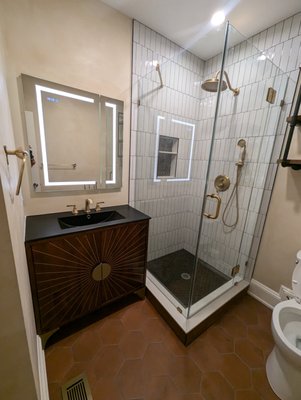 Luxury Custom Bath Remodel | Boston, MA - Transform your daily routine with a bathroom that feels like a boutique hotel. This recent Boston renovation is a perfect example of how we combine bold, modern design with functional luxury. We moved away from the "standard" look to create a custom space featuring a striking sunburst-patterned vanity, matte black accents, and premium champagne bronze hardware. Luxury Custom Bath Remodel | Boston, MA - Transform your daily routine with a bathroom that feels like a boutique hotel. This recent Boston renovation is a perfect example of how we combine bold, modern design with functional luxury. We moved away from the "standard" look to create a custom space featuring a striking sunburst-patterned vanity, matte black accents, and premium champagne bronze hardware.