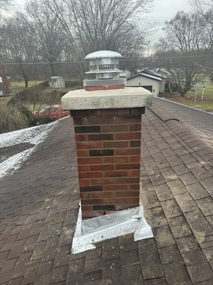 Complete grind out and tuck point with new flu and cap. We use a sealer/waterproof that helps the chimney not get so much moisture. - This job was a complete grind out, tuck point from the roofline to the crown. We added a new crown, new flu, and a chimney cap