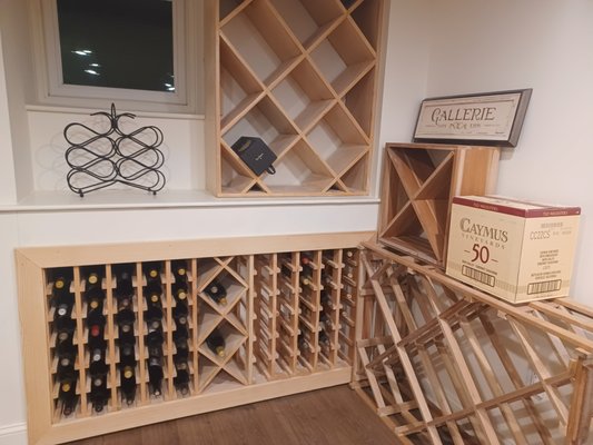 Custom Built-in Wine Rack and Cooler - This custom built wine rack, storage and cooler was built to enhance and display a client's impressive wine collection. Custom Built-in Wine Rack and Cooler - This custom built wine rack, storage and cooler was built to enhance and display a client's impressive wine collection.