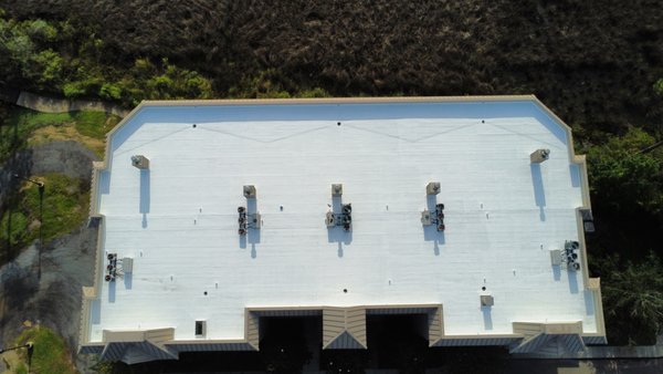 Condo Roof Coating - This condo building had tenants experiencing multiple leaks as a result of weathered roofing, and the roof was nowhere near its life expectancy. We used a urethane system to cover all laps and seams, and the entire roof had a coat of urethane applied. We then sprayed a coat of Silicone Condo Roof Coating - This condo building had tenants experiencing multiple leaks as a result of weathered roofing, and the roof was nowhere near its life expectancy. We used a urethane system to cover all laps and seams, and the entire roof had a coat of urethane applied. We then sprayed a coat of Silicone