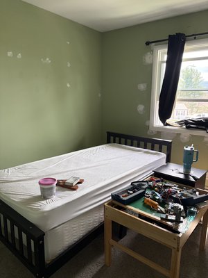Kids Bedroom - This room had worn green walls with visible patchwork and imperfections throughout. The space felt dated and unfinished, with uneven surfaces and no cohesive design.
The room has been completely transformed with a smooth, professionally finished dark gray paint that adds depth and a modern feel. The walls are now flawless, creating a clean backdrop that brings the entire space together. Paired with updated decor and lighting, the room now feels fresh, stylish, and inviting. Kids Bedroom - This room had worn green walls with visible patchwork and imperfections throughout. The space felt dated and unfinished, with uneven surfaces and no cohesive design.
The room has been completely transformed with a smooth, professionally finished dark gray paint that adds depth and a modern feel. The walls are now flawless, creating a clean backdrop that brings the entire space together. Paired with updated decor and lighting, the room now feels fresh, stylish, and inviting.
