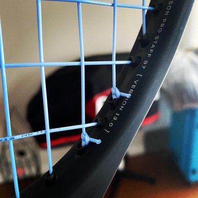 Wilson Pro Staff 97 v13 - Restrung with (Blue) Alu Power 125 at 52lbs on the mains and 48lbs on the crosses. Wilson Pro Staff 97 v13 - Restrung with (Blue) Alu Power 125 at 52lbs on the mains and 48lbs on the crosses.