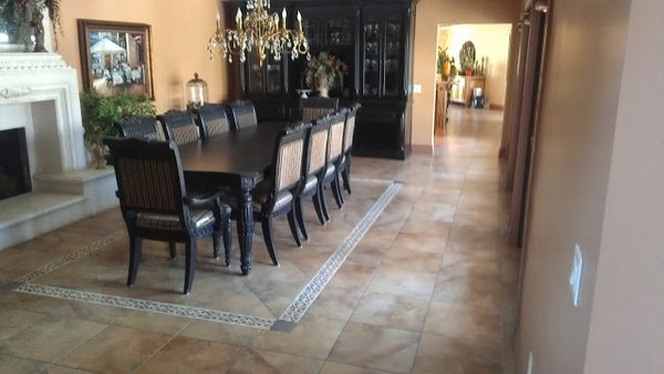Tile Inlays and borders - Instead of a rug this customer wanted a border around the table and wood inlay in the entry Tile Inlays and borders - Instead of a rug this customer wanted a border around the table and wood inlay in the entry