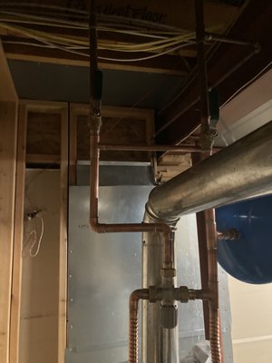 55 gallon ultra high recovery water heater - This project started as a disaster as it had flooded my clients basement. I was able to walk my client though turning off water to the water heater over the phone to limit flooding. When I arrived I examined existing water heater and found that the take itself had ruptured and there was no repair. I then proceeded to give the client multiple options for replacement including replacing the 2 50 gallon water heaters with the 1 55 gallon water heaters. 55 gallon ultra high recovery water heater - This project started as a disaster as it had flooded my clients basement. I was able to walk my client though turning off water to the water heater over the phone to limit flooding. When I arrived I examined existing water heater and found that the take itself had ruptured and there was no repair. I then proceeded to give the client multiple options for replacement including replacing the 2 50 gallon water heaters with the 1 55 gallon water heaters.