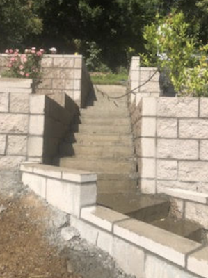 Concrete and masonry completed with attention to detail - Designed and constructed a custom concrete stairway with decorative wall. The project included concrete steps, masonry wall construction, and integrated landscape borders for a clean, finished appearance. Concrete and masonry completed with attention to detail - Designed and constructed a custom concrete stairway with decorative wall. The project included concrete steps, masonry wall construction, and integrated landscape borders for a clean, finished appearance.