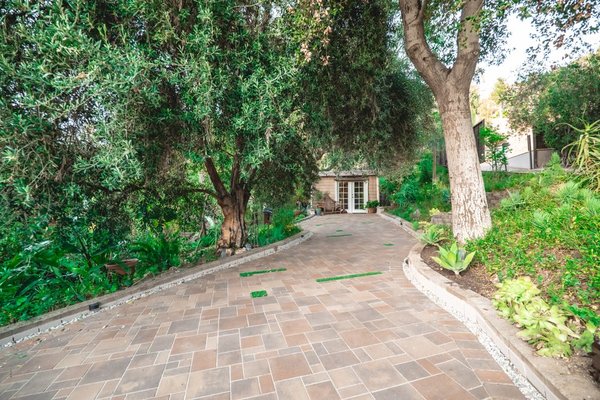 NEW DRIVEWAY Exterior, Los Angeles - A large area of complete new front driveway and landscaping by American Home Improvement. Pavers, hardscape, landscape. NEW DRIVEWAY Exterior, Los Angeles - A large area of complete new front driveway and landscaping by American Home Improvement. Pavers, hardscape, landscape.