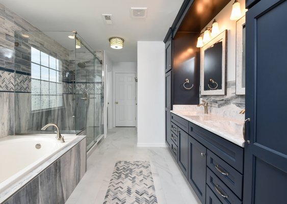 Transitional Bathroom Remodel - Transitional style bathroom remodel. Black shaker cabinets. Marble. Bathroom flooring. Bathroom tile backsplash. Double vanity. Glass door stand alone shower. Countertops. Large bathroom remodel. Transitional Bathroom Remodel - Transitional style bathroom remodel. Black shaker cabinets. Marble. Bathroom flooring. Bathroom tile backsplash. Double vanity. Glass door stand alone shower. Countertops. Large bathroom remodel.