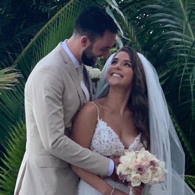 Destination Wedding - An Unforgettable Destination Wedding: Rebecca and Dan's Love Story at Generations Riviera Maya

Planning Rebecca and Dan's destination wedding at Generations Riviera Maya was truly a highlight of my career. With over 100 guests traveling to this breathtaking resort, the experience was magical, and I’m so honored to have been part of their journey.  

From the beginning, Rebecca and Dan were clear about their vision: a heartfelt ceremony in the resort’s beautiful beachfront chapel, followed by a lively celebration with their family and friends. It was an absolute joy to help them bring this dream to life. I take pride in my meticulous planning process, and I was excited to ensure that every detail was thoughtfully handled to make their day unforgettable.  

A Seamless Planning Experience for 100+ Guests
Coordinating travel and accommodations for over 100 guests is no small feat, but I thrive on making the process smooth and stress-free. For Rebecca and Dan, this meant:  
- Personalized Travel Assistance: Each guest received one-on-one support to book their travel arrangements. From selecting the right room category to answering questions about flights, I was available every step of the way.  
- Comprehensive Itineraries: To ensure guests felt prepared, I created detailed travel documents with everything they needed to know about the resort, events, and schedules.  
- Special Touches: From arranging group excursions to managing special requests, I worked closely with the resort team to ensure every guest felt welcomed and cared for.  

The Ceremony and Celebration
Rebecca and Dan’s ceremony took place in the stunning beachfront chapel, offering a serene and picturesque backdrop with panoramic ocean views. The intimate setting created a magical atmosphere, with natural light streaming in as they exchanged vows in front of their loved ones.  

Following the ceremony, guests enjoyed a vibrant cocktail hour on the terrace before moving to a lively reception. From the carefully curated dinner menu to the heartfelt speeches and energetic dancing, every moment reflected Rebecca and Dan’s love and personalities. Collaborating with the talented team at Generations Riviera Maya, I ensured that every detail—from the floral arrangements to the music—was executed perfectly.  

Why I Love What I Do
Helping couples like Rebecca and Dan bring their dream weddings to life is my greatest passion. I know how important every detail is, and I approach each celebration with care, precision, and creativity. Seeing my clients and their guests filled with joy and knowing I’ve played a part in creating lifelong memories is what inspires me every day.  

Rebecca and Dan’s wedding was a testament to the magic that happens when expert planning meets a couple’s unique vision. The beachfront chapel ceremony, the vibrant celebration, and the love shared by their family and friends made it an unforgettable experience.  

If you’re dreaming of a destination wedding, I’d love to help you turn your vision into reality. With over 15 years of experience and a genuine passion for planning unforgettable celebrations, I’m here to ensure your big day is everything you’ve dreamed of and more. Let’s start planning your perfect day!