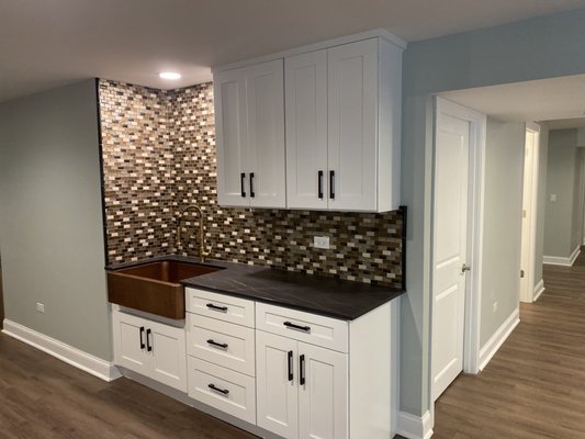 In law suite/basement remodel - Transformed basement into an in law suite with a full functioning kitchen, master bathroom, walk-in closet, and new flooring and paint throughout.