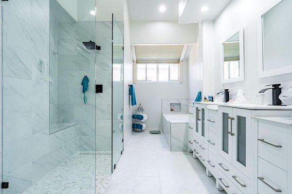 Master Curbless Shower (& ADA compliant) - This stunning bathroom remodel features a curbless shower, infinity drain, custom tiling around the tub and a perfect tub nice. All the tiles featured are gorgeous ceramic tiles. Master Curbless Shower (& ADA compliant) - This stunning bathroom remodel features a curbless shower, infinity drain, custom tiling around the tub and a perfect tub nice. All the tiles featured are gorgeous ceramic tiles.