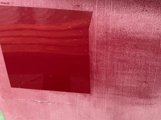 Heavy oxidation removal from a red boat - The client had a paint job scheduled for his boat.  We did a test spot to confirm that we could bring it back.  Paint job cancelled.