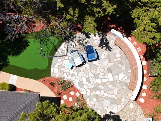 Relaxing Yard with Mini Golf and Fountain - In this latest yard project, we’ve created a relaxing, countryside-inspired outdoor space. The design highlights include a mini golf course, perfect for family and friends to enjoy some fun activities. At the center, there’s a calming fountain that adds a soothing touch with its gentle water sounds. Surrounding it is a circular bench, inviting everyone to gather and relax in the beauty of the outdoors. This unique yard design combines aesthetics with functionality, making it an ideal spot for relaxation!