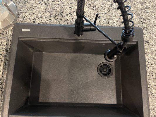 Kitchen Farm sink and facet install - Old stainless sink and faucet (builders grade) removed and new Farmhouse Granite Composite sink installed with new complimentary faucet.  Also, new garbage disposal installed to complete the job.