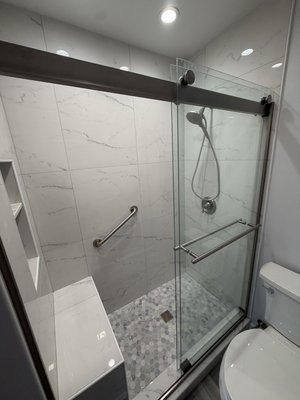 Modern Bathroom Remodel
with Hex Tile Shower Floor
In Waukegan IL - We recently completed this modern bathroom remodel featuring a custom walk-in shower, hex tile floor, and frameless glass enclosure. Clean, durable, and built to last. Contact Renova Tiles & Remodeling for your next project.
💰 Now offering financing through U.S. Bank Avvance — make your project more affordable with flexible payment options. Modern Bathroom Remodel
with Hex Tile Shower Floor
In Waukegan IL - We recently completed this modern bathroom remodel featuring a custom walk-in shower, hex tile floor, and frameless glass enclosure. Clean, durable, and built to last. Contact Renova Tiles & Remodeling for your next project.
💰 Now offering financing through U.S. Bank Avvance — make your project more affordable with flexible payment options.