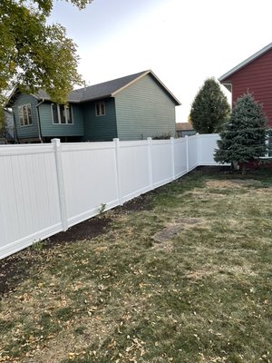 Vinyl Privacy Fence - 6’ tall white vinyl fence that was installed with two separate gates. Vinyl Privacy Fence - 6’ tall white vinyl fence that was installed with two separate gates.