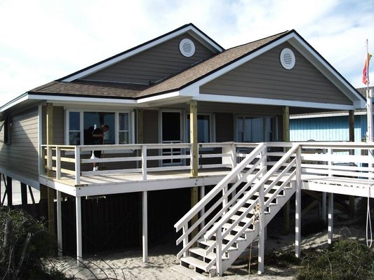 Ocean Front Outdoor Addition - The owner wanted to expand the outdoor living space for his beachfront home. We also re-stabilzed the foundation, installed all new James Hardi fiber cement siding (using stainless steel nails), new roof, and interior renovations also. Ocean Front Outdoor Addition - The owner wanted to expand the outdoor living space for his beachfront home. We also re-stabilzed the foundation, installed all new James Hardi fiber cement siding (using stainless steel nails), new roof, and interior renovations also.
