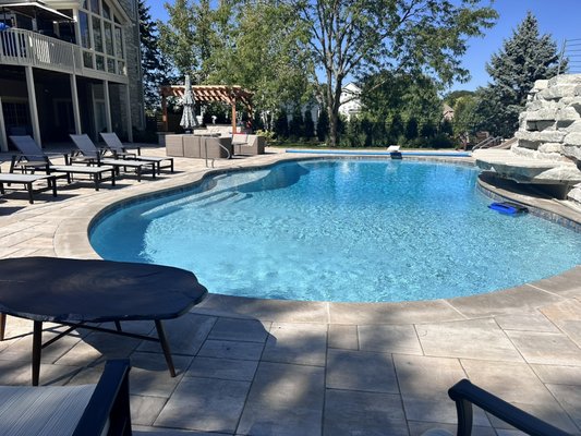 Hawthorn Woods: Transforming a Backyard into a Luxurious Oasis! - We're thrilled to showcase this breathtaking pool project, where we turned a ordinary yard into an extraordinary entertainer's paradise! This stunning outdoor retreat features:
- A majestic freeform pool
- Over 2,800 sq ft of exquisite pavers
- A thrilling pool slide
- A breathtaking limestone waterfall
- Cozy fire pit
- A gourmet outdoor kitchen
- A charming cedarwood pergola
This incredible space is perfect for relaxing, entertaining, and making unforgettable memories! Hawthorn Woods: Transforming a Backyard into a Luxurious Oasis! - We're thrilled to showcase this breathtaking pool project, where we turned a ordinary yard into an extraordinary entertainer's paradise! This stunning outdoor retreat features:
- A majestic freeform pool
- Over 2,800 sq ft of exquisite pavers
- A thrilling pool slide
- A breathtaking limestone waterfall
- Cozy fire pit
- A gourmet outdoor kitchen
- A charming cedarwood pergola
This incredible space is perfect for relaxing, entertaining, and making unforgettable memories!