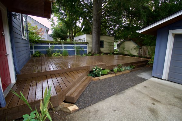 Trex Deck - We ripped out a large rotten deck and put in a larger sturdier gorgeous Trex deck that will never rot. We then wrapped the entire thing in colorful plantings for year-round privacy and interest. Trex Deck - We ripped out a large rotten deck and put in a larger sturdier gorgeous Trex deck that will never rot. We then wrapped the entire thing in colorful plantings for year-round privacy and interest.