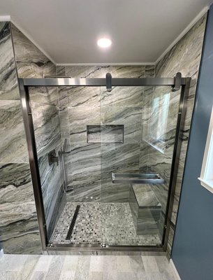Bathtub-to-Shower Transformation - "From Soak to Splash: A Bathtub-to-Shower Transformation
We transformed this outdated bathtub into a sleek, modern shower oasis!
Before:
- A bulky, hard-to-clean bathtub took center stage
- Limited accessibility and mobility
- Outdated fixtures and tile
After:
- A spacious, walk-in shower with a low-threshold entry
- Rain showerhead and body sprays for a spa-like experience
- Modern, slip-resistant tile and sleek glass enclosure
- Increased accessibility and ease of use
This transformation not only updates the look and feel of the bathroom but also improves functionality and safety. Whether you're looking to upgrade your bathroom or improve accessibility, we can help! Bathtub-to-Shower Transformation - "From Soak to Splash: A Bathtub-to-Shower Transformation
We transformed this outdated bathtub into a sleek, modern shower oasis!
Before:
- A bulky, hard-to-clean bathtub took center stage
- Limited accessibility and mobility
- Outdated fixtures and tile
After:
- A spacious, walk-in shower with a low-threshold entry
- Rain showerhead and body sprays for a spa-like experience
- Modern, slip-resistant tile and sleek glass enclosure
- Increased accessibility and ease of use
This transformation not only updates the look and feel of the bathroom but also improves functionality and safety. Whether you're looking to upgrade your bathroom or improve accessibility, we can help!