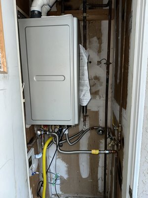 More Tankless Water Heaters! - Take a look at a few of our tankless water heater projects. Your tankless water heater options will depend on the size of your home and the distance from where your heater is located. Larger homes will likely require a water recirculation pump although some tankless units include this component. Proper installation to code also requires an expansion tank which helps protect your home. An isolation valve kit is required for the servicing of your unit which you'll want to do in order to maintain and prolong it's life, which in turn saves you money. A descale filter will help break down minerals in your water such as calcium and prevent them from turning into stones which then clog your plumbing. Call today to learn more! More Tankless Water Heaters! - Take a look at a few of our tankless water heater projects. Your tankless water heater options will depend on the size of your home and the distance from where your heater is located. Larger homes will likely require a water recirculation pump although some tankless units include this component. Proper installation to code also requires an expansion tank which helps protect your home. An isolation valve kit is required for the servicing of your unit which you'll want to do in order to maintain and prolong it's life, which in turn saves you money. A descale filter will help break down minerals in your water such as calcium and prevent them from turning into stones which then clog your plumbing. Call today to learn more!