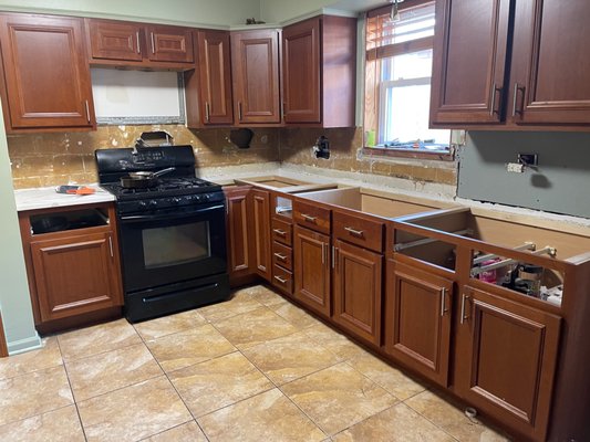 Full Kitchen Teardown and Remodel - This remodel was done on an old kitchen where we resurfaced the cabinetries and added all new appliances, backdrop and countertops Full Kitchen Teardown and Remodel - This remodel was done on an old kitchen where we resurfaced the cabinetries and added all new appliances, backdrop and countertops