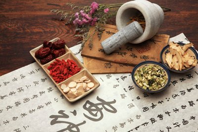 Chinese Herbal Medicine - Chinese Herbal Medicine and acupuncture are complementary therapeutic modalities often used together in the treatment of a variety of medical conditions. Over the past 5,000 years, Chinese herbology has evolved into an art form of its own. Ancient herbal information was gathered, compiled, formulated, tested and handed down from generation to generation.

This compiled knowledge was leveraged in the 1960’s when the application of Chinese Herbal Medicine led to the discovery of an effective treatment for malaria. Recently, this rich history has been examined through the lens of the scientific method utilized in modern western medicine with promising results. Medical professionals are increasingly prescribing Chinese Herbal Medicine as a direct and complementary treatment for health issues that range from heart disease to IBS to the common flu.

Prescribing Herbal Medicine
In Chinese medical theory, food is medicine. There are five flavors that go to specific organs to benefit their function. The tastes are bitter, sour, sweet, pungent and salty. Bitter aids the heart, sweet benefits digestion, pungent boosts the lungs, sour helps the liver and salty charms the kidneys. Herbal formulas are usually either warming, cooling, tonifying, purging, calming or invigorating.

Individual herbs are combined in order to enhance their actions and effects on the body. When combined, a unique, synergistic formula is created. This combination increases the benefits of a particular formula and minimizes any harmful side effects.

In order to create the most effective formula, the herbs are used in different quantities and for different purposes. This allows the herbalist to create a formula aimed at addressing individual needs.

Tray of Chinese herbs modalityThe art and skill of creating a formula lies within choosing the precise and most effective herbs that target an individual’s disharmony. It is important to work with a qualified herbalist who can prescribe the correct formula, monitor progress and adjust the dosage and herbs as needed.

Formulas can be prescribed in a number of ways: 

Raw herbs that are boiled into a tea
Liquid extracts
Pills
Powders
How a Formula Works
Herbal formulas can have about eight to 15 or more herbs in a combination. This combination of herbs ensures the formula is effective, potent and gentle. Usually, there are chief herbs that target the main symptom, then there are assisting herbs and the harmonizer herb. Herbal formulas can help treat both the root and the branch of an ailment. The root is the main cause, the origin, and the branch is the symptom.

A formula can treat an acute symptom, such as a cold, and also a chronic disease associated with one of the organs, such as the kidneys. A unique thing about herbal formulas is they change as the disease changes and are modified to suit your unique constitution. There are short-term formulas and long-term formulas depending on the nature of the disease.

When an herbal formulation is produced, there is a universal method for creating a balanced formula.  This method creates a chain of command that dictates the amount and use of herbal ingredients within a combined formula.  The herbs are categorized as “Chief”, “Deputy”, “Assistant”, and “Envoy”. The order of the herbs ensures a harmonious formula that is created specifically for an individual to treat their needs.

Herbal extracts work best in combination with others in the formulation to be most effective.