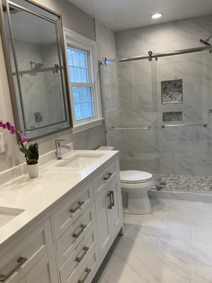 Clean and inviting bathroom - Transform your older bathrooms to a new beautiful and inviting space with replacing tub with stand up shower, larger tiles to visually expand the bathroom, and lighter cabinets to open up the space. Clean and inviting bathroom - Transform your older bathrooms to a new beautiful and inviting space with replacing tub with stand up shower, larger tiles to visually expand the bathroom, and lighter cabinets to open up the space.