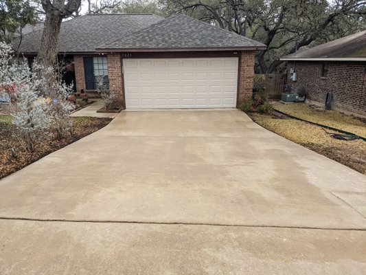 Restoring the curb appeal - This cleaning was done on a driveway, sidewalk, and entryway that had years of dirt, mold, and algae build up. With one pressure wash, we were able to remove the buildup and restore this home owner's curb appeal.