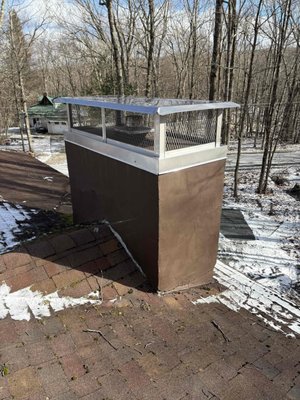 Outside Mount Cap - Called out for an annual inspection and sweep, it was noted that water was gaining entry and causing the facade to crack. First step, help prevent further water entry. This was done by installing an outside mount cap, this keeps water from sitting on the top of the chimney and dripping down the sides. Further work to be done, but step one is a beautiful success!