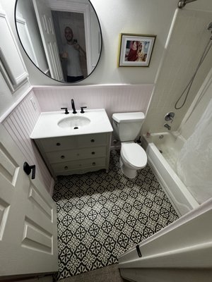 Kids Bathroom Renovation - Full bathroom renovation. Wall panels with trim installed, new baseboards, soft pink paint. New vanity with sink and faucet, toilet reinstalled. Tile installed over cement board with double waterproofing. Clean, durable finish. Kids Bathroom Renovation - Full bathroom renovation. Wall panels with trim installed, new baseboards, soft pink paint. New vanity with sink and faucet, toilet reinstalled. Tile installed over cement board with double waterproofing. Clean, durable finish.