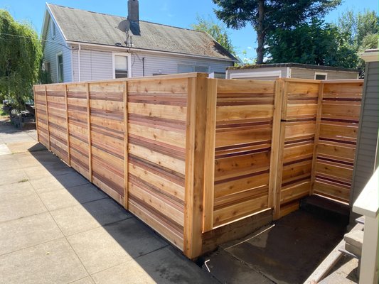 Cedar Fence Construction - Enhance your property’s curb appeal and privacy with the Cedar Fence from Stellar Decking. Crafted from high-quality, sustainably sourced cedar, this fence combines natural elegance with robust functionality to create a lasting impression.
timeless Beauty: The Cedar Fence boasts a warm, rich color and distinctive grain patterns that provide a classic, sophisticated look. Its natural hues and textures blend seamlessly with various architectural styles, adding charm and character to any landscape.
Exceptional Durability: Cedar’s natural resistance to rot, decay, and insect damage makes it an ideal choice for fencing. This fence is designed to withstand the elements, ensuring long-term durability and minimal maintenance.
Precision Craftsmanship: Built by Stellar Decking, this fence exemplifies superior craftsmanship with meticulously cut and fitted boards. The sturdy construction and attention to detail ensure a fence that stands strong and maintains its beauty over time.
Privacy and Security: The Cedar Fence provides excellent privacy and security for your property. Its solid construction offers a secure boundary while creating a tranquil retreat away from prying eyes.
Eco-Friendly Construction: Cedar is a renewable resource, and Stellar Decking’s commitment to eco-friendly practices ensures that your fence is an environmentally responsible choice.
Low Maintenance: With its natural resistance to the elements, this cedar fence requires minimal upkeep. A simple annual inspection and occasional treatment will keep it looking pristine. Cedar Fence Construction - Enhance your property’s curb appeal and privacy with the Cedar Fence from Stellar Decking. Crafted from high-quality, sustainably sourced cedar, this fence combines natural elegance with robust functionality to create a lasting impression.
timeless Beauty: The Cedar Fence boasts a warm, rich color and distinctive grain patterns that provide a classic, sophisticated look. Its natural hues and textures blend seamlessly with various architectural styles, adding charm and character to any landscape.
Exceptional Durability: Cedar’s natural resistance to rot, decay, and insect damage makes it an ideal choice for fencing. This fence is designed to withstand the elements, ensuring long-term durability and minimal maintenance.
Precision Craftsmanship: Built by Stellar Decking, this fence exemplifies superior craftsmanship with meticulously cut and fitted boards. The sturdy construction and attention to detail ensure a fence that stands strong and maintains its beauty over time.
Privacy and Security: The Cedar Fence provides excellent privacy and security for your property. Its solid construction offers a secure boundary while creating a tranquil retreat away from prying eyes.
Eco-Friendly Construction: Cedar is a renewable resource, and Stellar Decking’s commitment to eco-friendly practices ensures that your fence is an environmentally responsible choice.
Low Maintenance: With its natural resistance to the elements, this cedar fence requires minimal upkeep. A simple annual inspection and occasional treatment will keep it looking pristine.