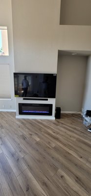 Gas fireplace replaced with electric - Customer wanted to upgrade his gas fireplace with a more modern electric fireplace. We built a custom flush soundbar opening. we also installed a 65" Tv. Patched drywall and flooring. Gas fireplace replaced with electric - Customer wanted to upgrade his gas fireplace with a more modern electric fireplace. We built a custom flush soundbar opening. we also installed a 65" Tv. Patched drywall and flooring.