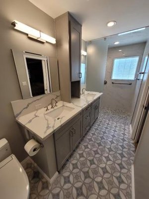 Bathroom Remodel 2023 - Full Bathroom Remodel. Bathroom was outdated and we needed to make it handicap accessible. We remodel the shower to be stepless, added shampoo Niche and floating Bench. New tile, New vanity, new quartz countertops. This project turned out beautiful and now our clients can access this anytime.