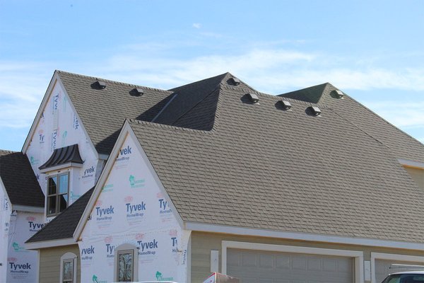 Brookfield, WI - Weathered Wood Asphalt Roof - This newly constructed house is located in the Homes by Chapel Hill neighborhood of Brookfield. Chapel Hill is an exclusive subdivision of luxury homes. BCI has been working with Kings Way Family Home Building Companies for over 27 years. They continue to grow as an industry leader in the design, construction, and promotion of quality single-family homes. 

The roof features a GAF Timberline Natural Shadow asphalt shingle in the Weathered Wood color. Timberline Natural Shadow shingles give an upscale, architectural look you want at a price you can afford.