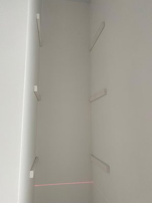 Bathroom storage shelves installation - Installed wooden shelves in an empty space in bathroom. Brackets fixed to a drywall on one side and to a concrete wall on the other side. Shelves coated with a wood oil. Brackets primed and painted in white. Bathroom storage shelves installation - Installed wooden shelves in an empty space in bathroom. Brackets fixed to a drywall on one side and to a concrete wall on the other side. Shelves coated with a wood oil. Brackets primed and painted in white.