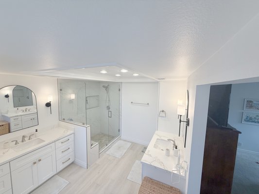 Bathroom Remodeling With Shower - This Orange County master bathroom was overdue for an upgrade. ALLOC Kitchen & Bath gutted the old layout and rebuilt it with a custom double vanity, frameless glass walk-in shower, marble tile floors, and recessed lighting throughout — delivering a clean, bright, spa-quality finish the homeowner loves.