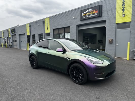Color Shifting Vinyl Wrap - Model Y - Tesla Model Y from White to Purple- Green color shifting. Color Shifting Vinyl Wrap - Model Y - Tesla Model Y from White to Purple- Green color shifting.