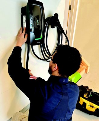 EV / Tesla Charger Installation - Luis showing off a new EV charging install. Get your install done by a five star rated team. We guarantee 100% customer satisfaction. EV / Tesla Charger Installation - Luis showing off a new EV charging install. Get your install done by a five star rated team. We guarantee 100% customer satisfaction.