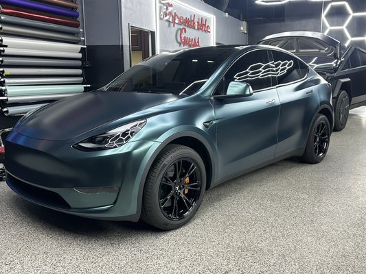 AWESOME MODEL Y PROJECT - Wrapped in satin metallic green 
Finished with full ceramic tint Powdercoated wheels Caliper paint And sealed with a 4 year ceramic coating
