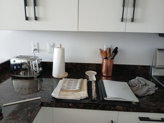 Kitchen backsplash - Owners wanted to keep the existing 4' granite backsplash and install ceramic tiles up to the base of the cabinets